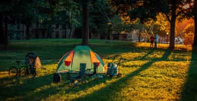 a tent is set up in a grassy field